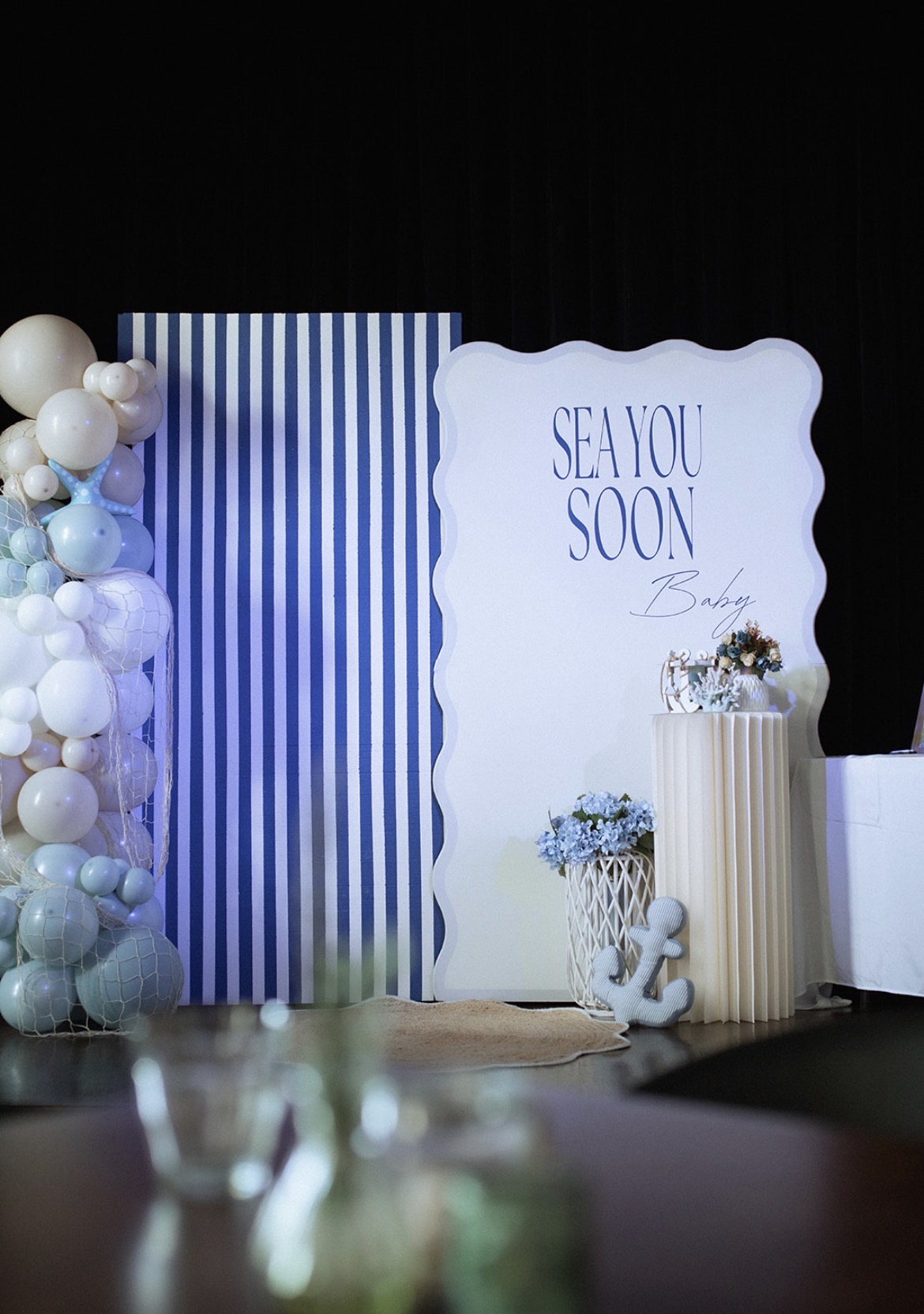 Sea You Soon nautical baby shower backdrop with balloons